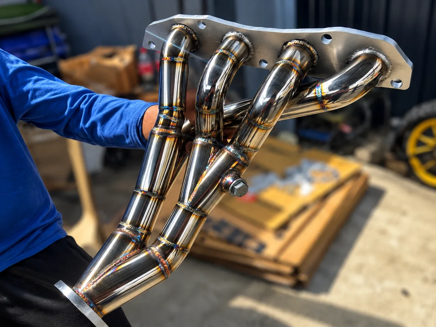 Custom stainless steel four-into-one headers with TIG welds