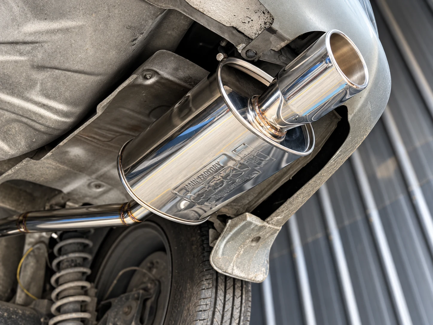 A Japanese muffler with a visible brand marking