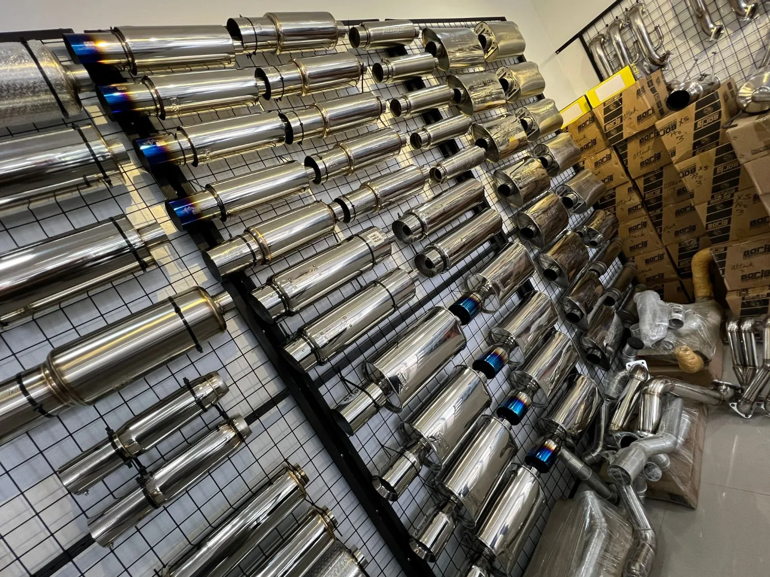 Wall of stainless mufflers