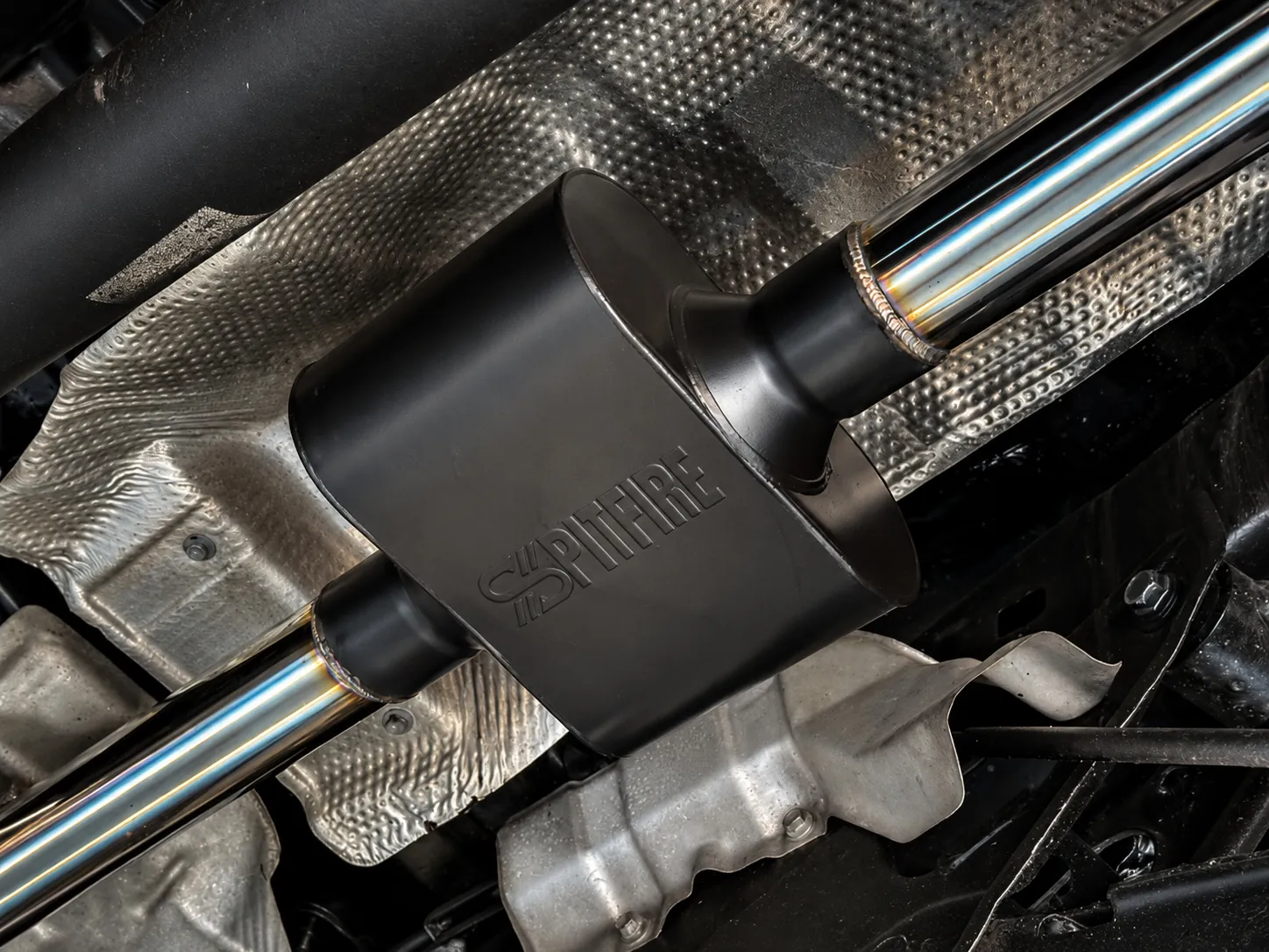 Spitfire chambered muffler under a vehicle